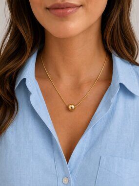 Gold tone Ball pendant necklace